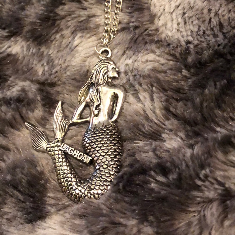 A silver mermaid necklace